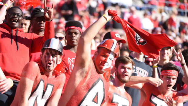 Wolfpack fans cheer during the first half against the Florida State Seminoles at Carter-Finley Stadium. (Rob Kinnan-USA TODAY Sports)